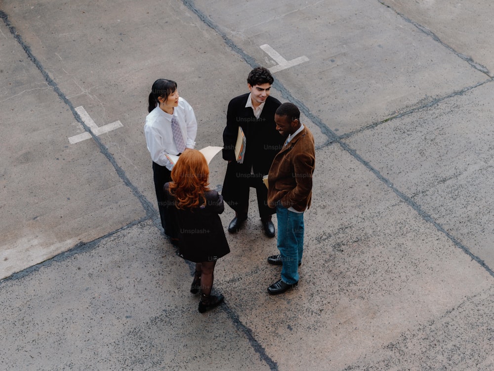 a group of people standing in a parking lot