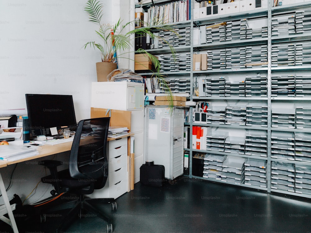 a desk with a computer on it in a room