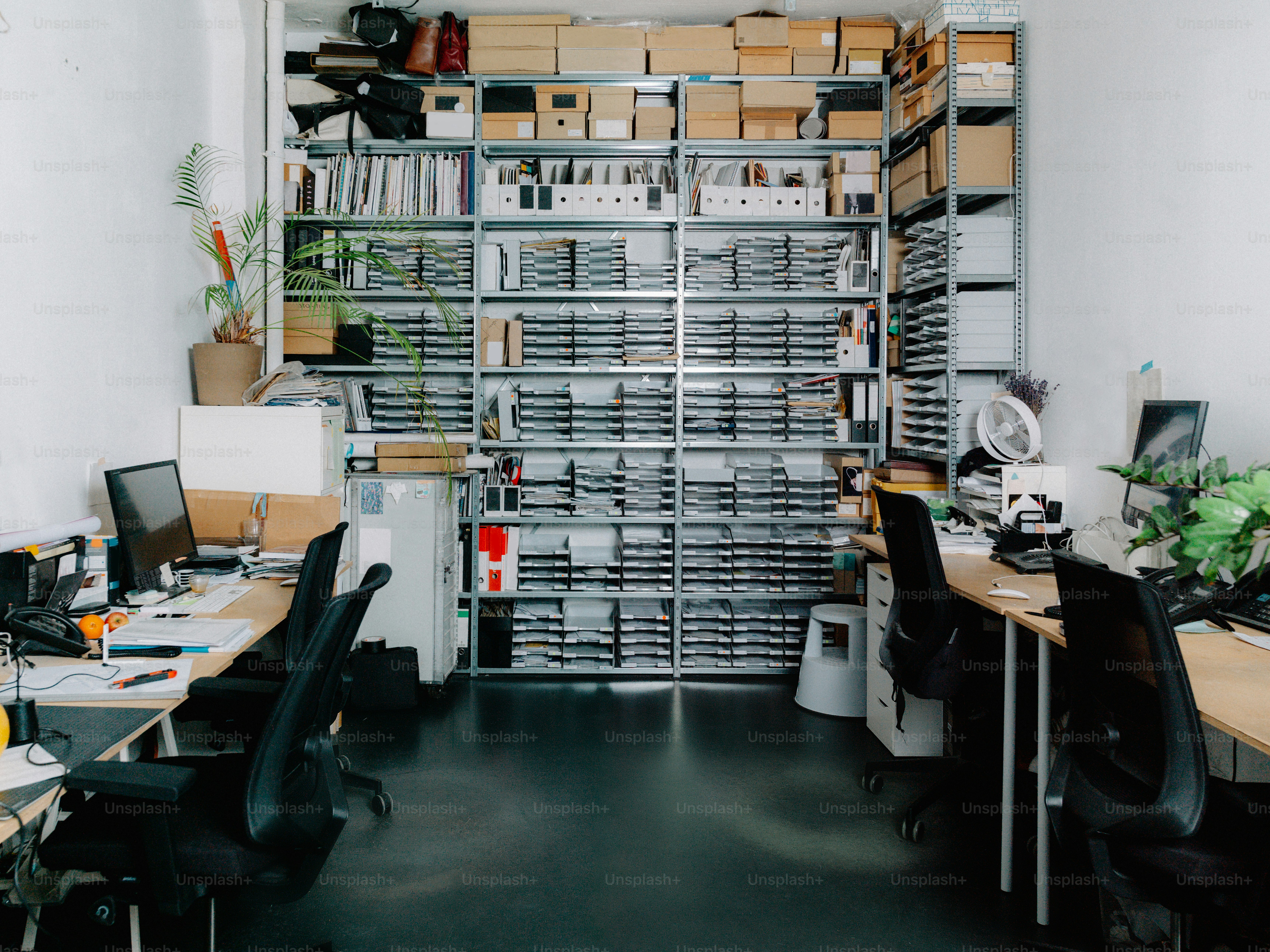 a room filled with lots of desk and chairs