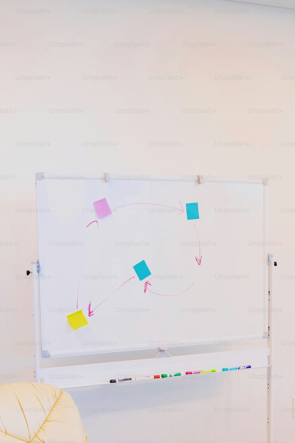 a white board with colored squares on it