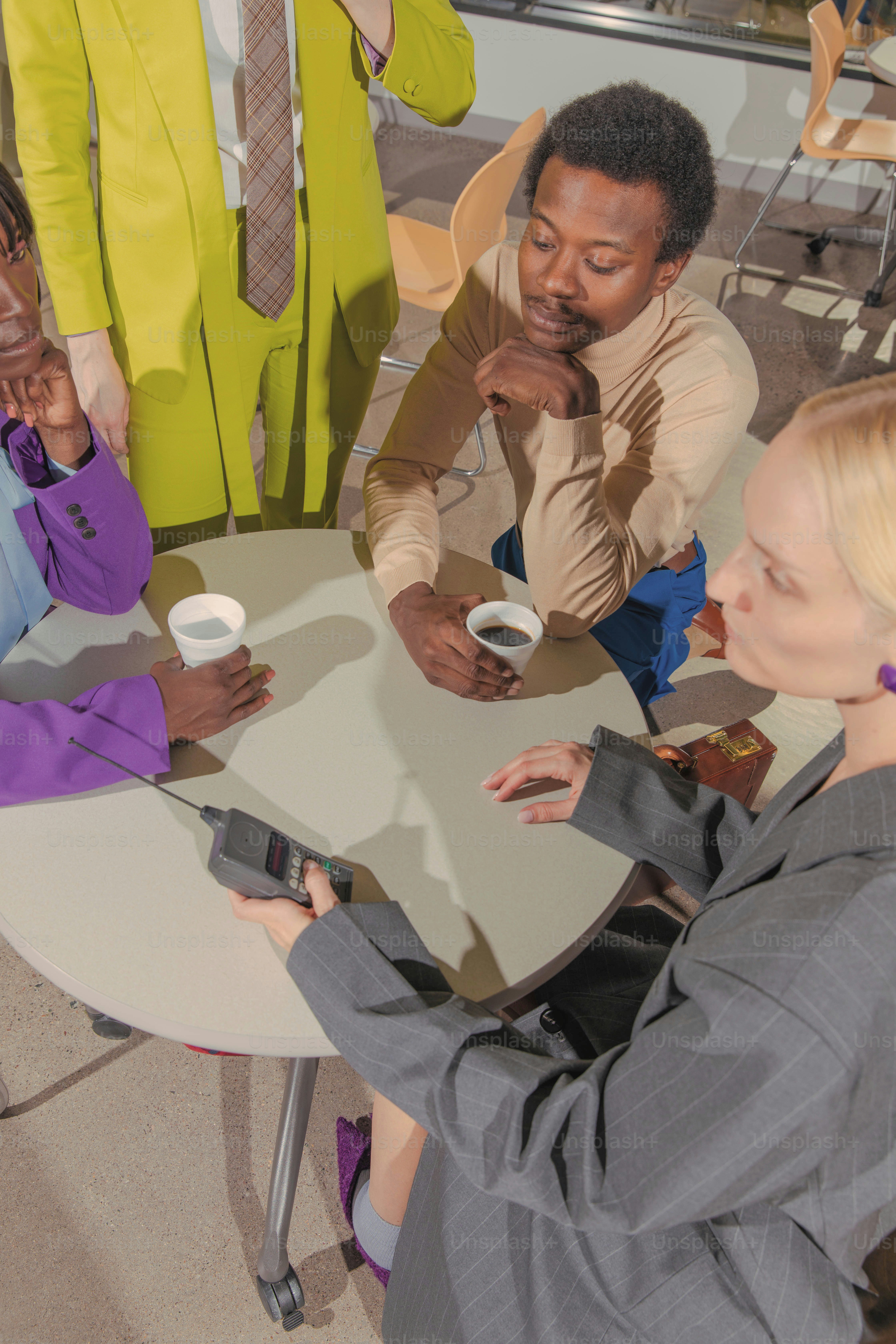a group of people sitting around a table