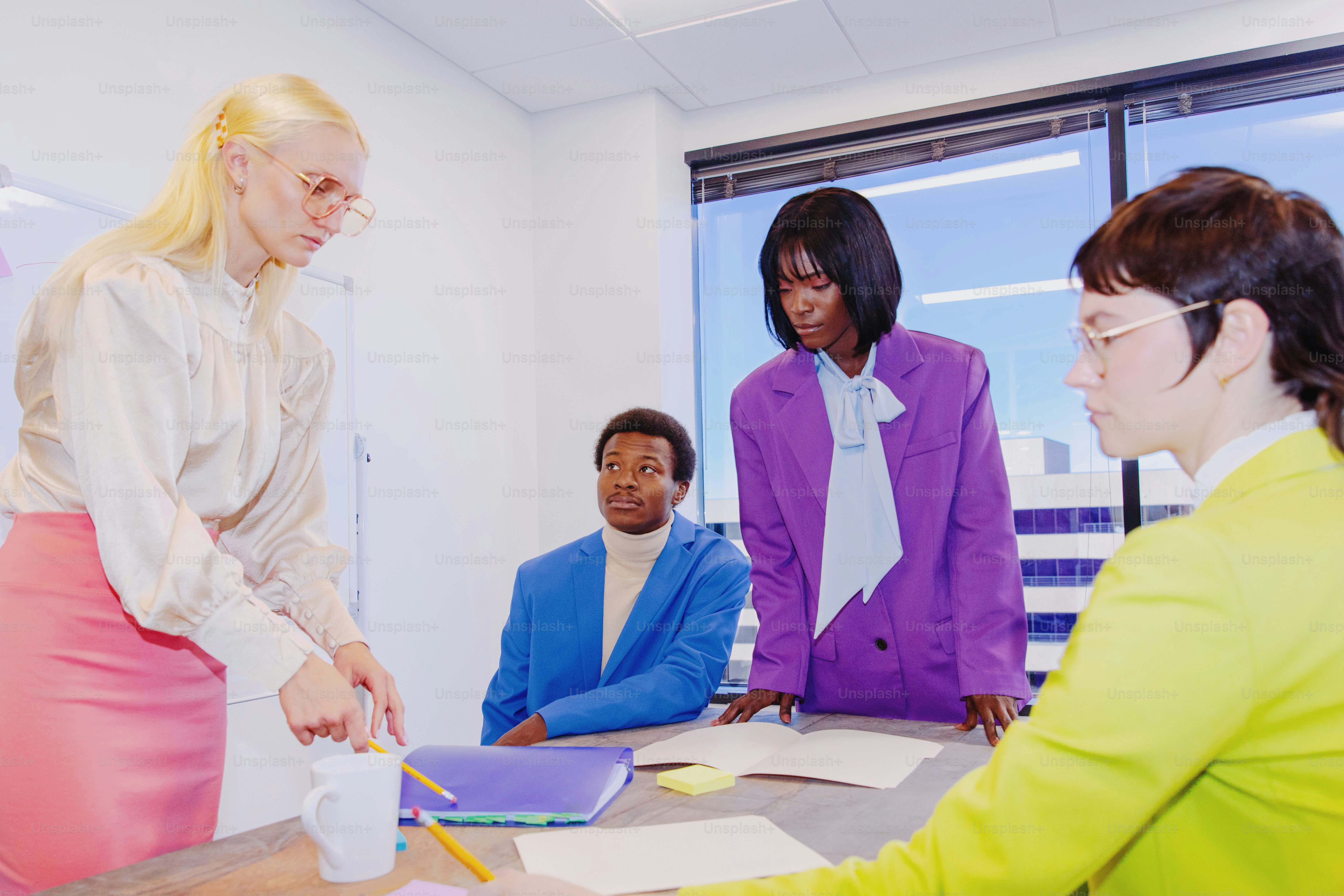 a group of women standing around a table