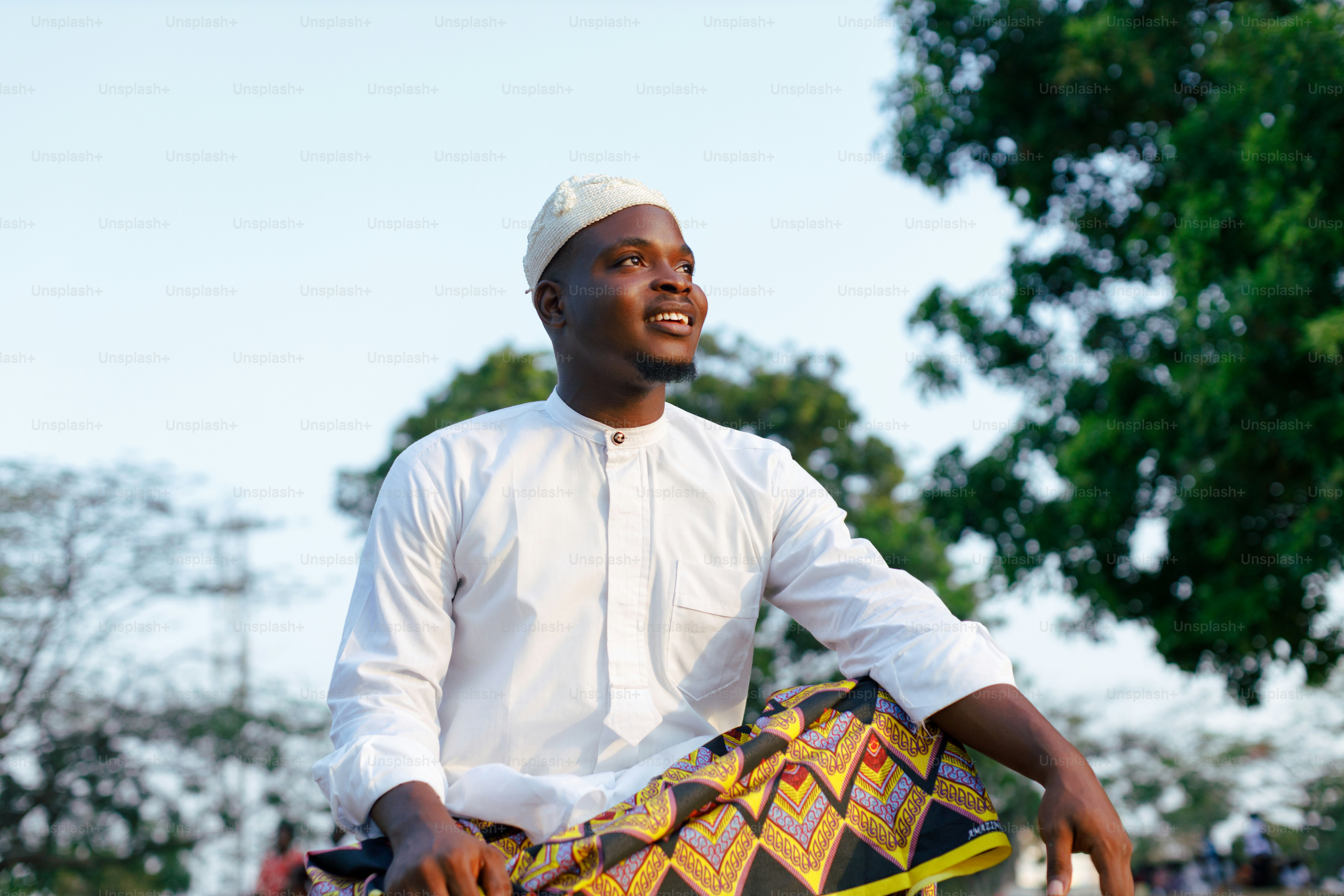 a man in a white shirt holding a kite