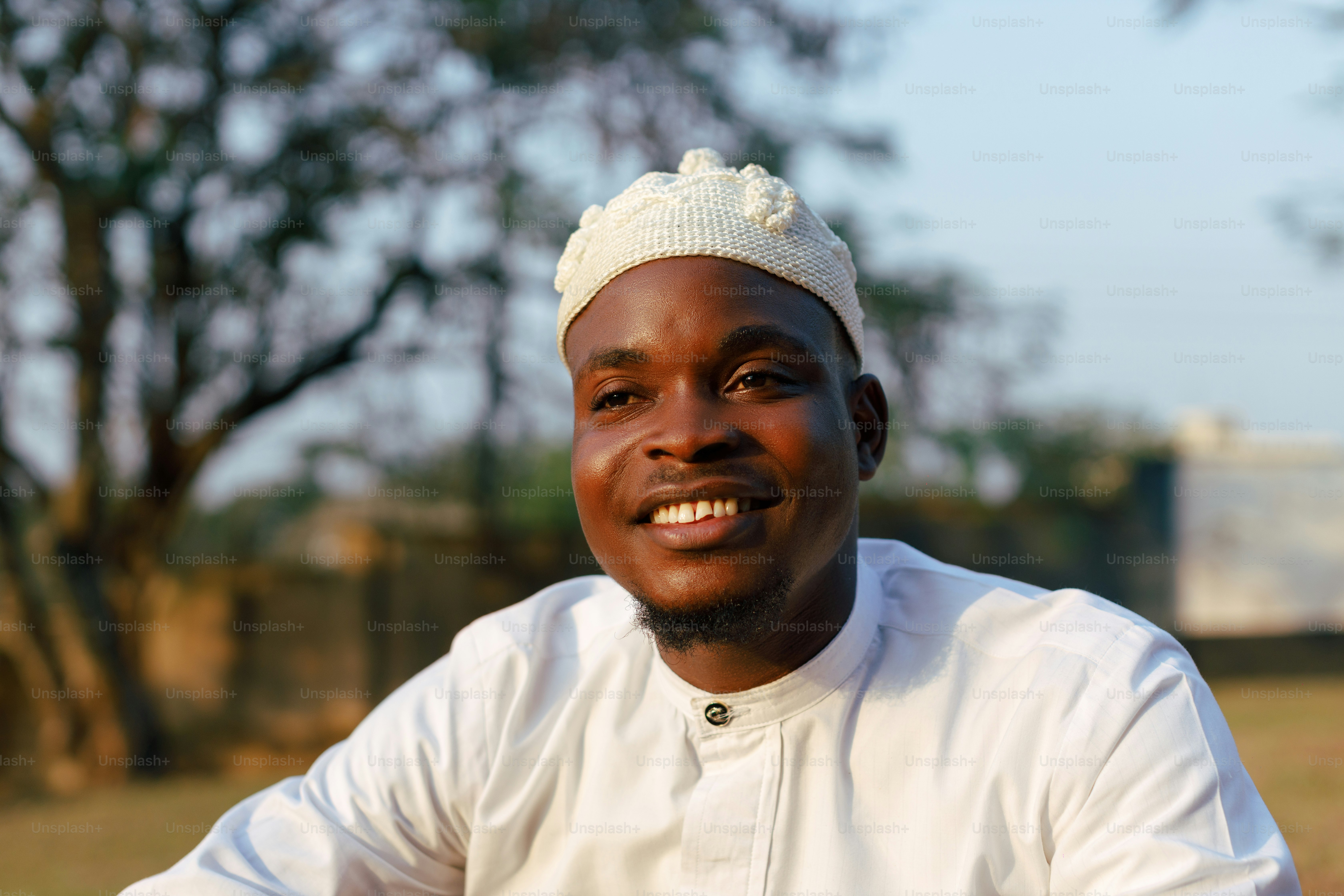 a man in a white shirt and a white hat