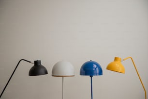 a group of three lamps sitting on top of a table