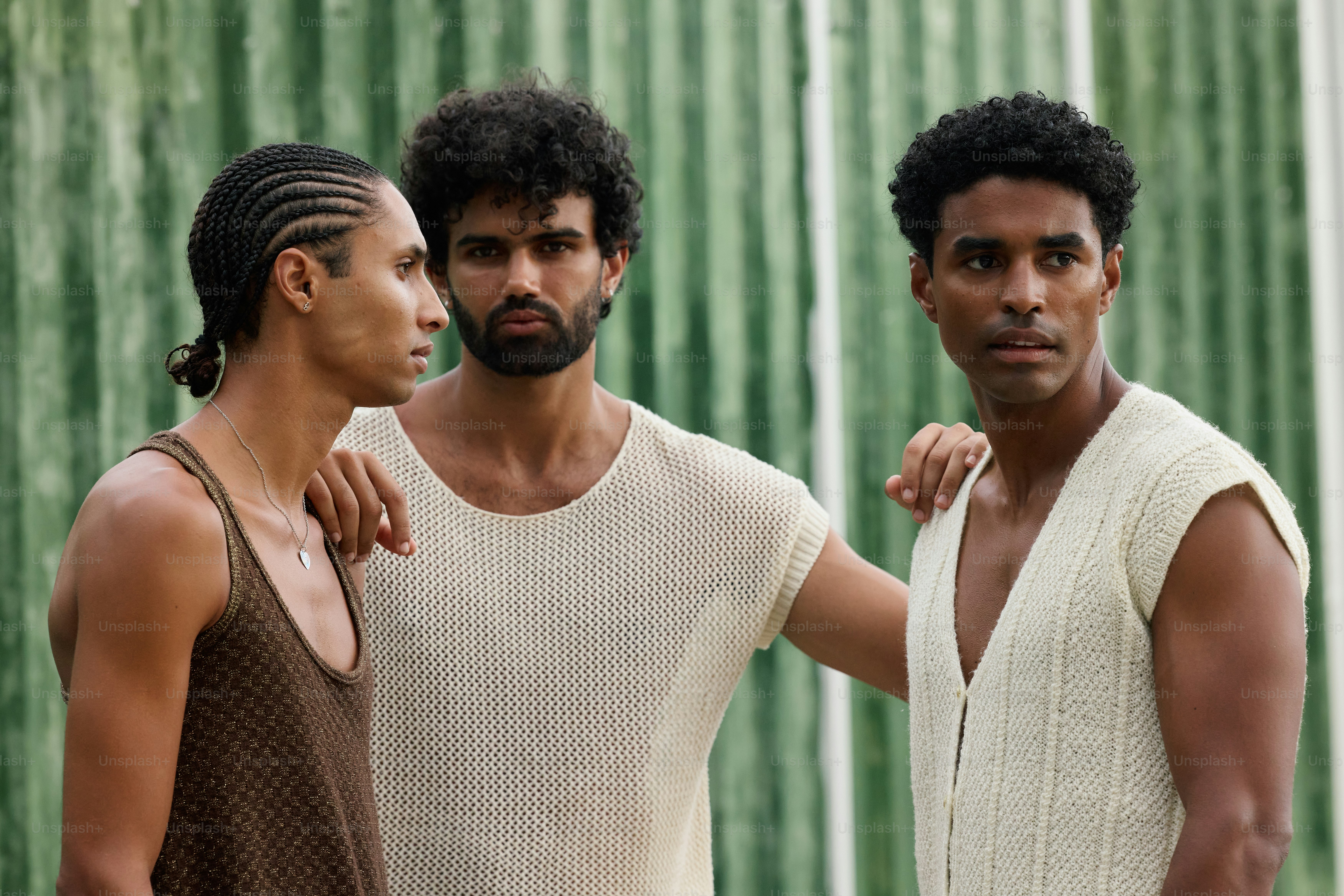 A group of three men standing next to each other photo – Friendship ...