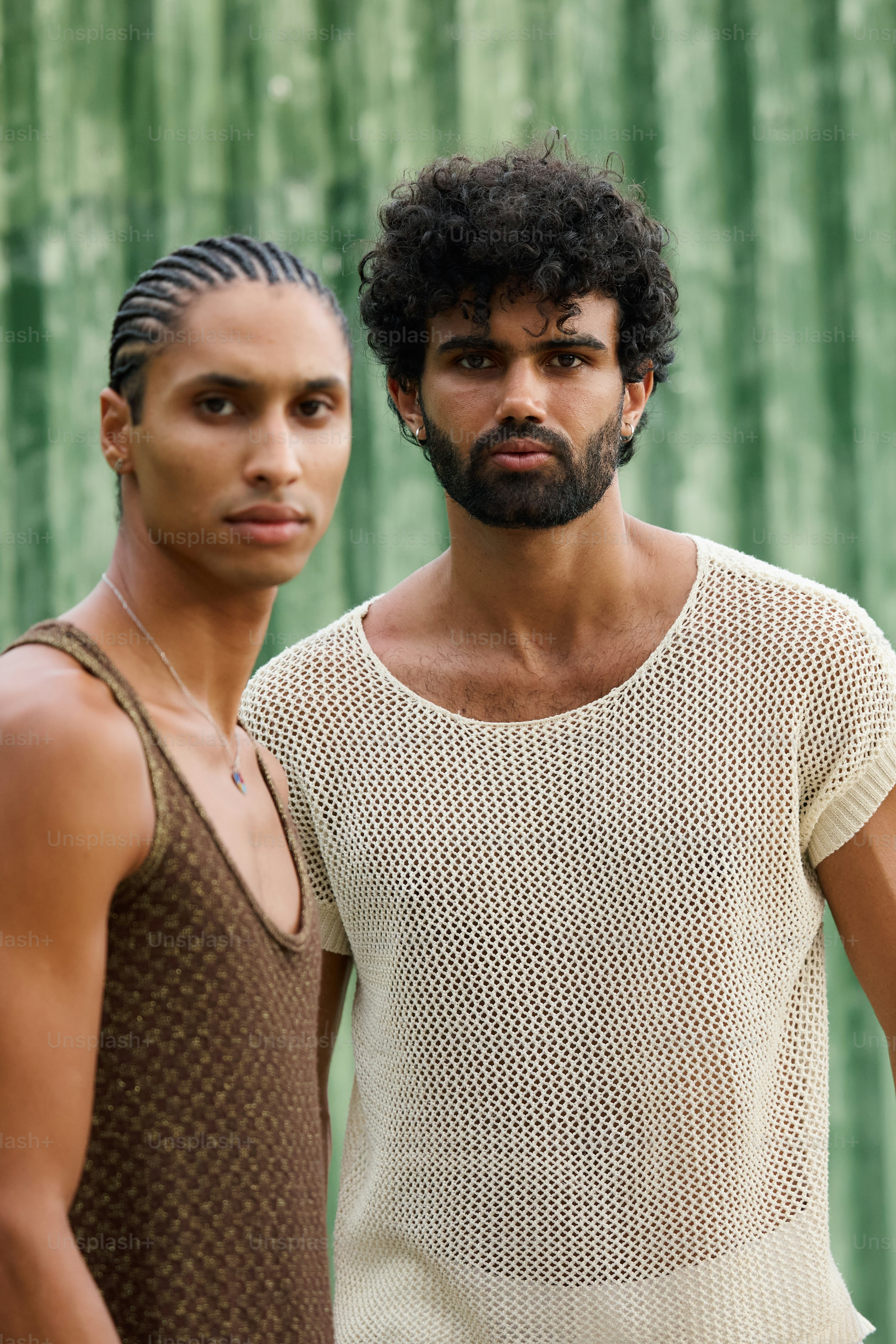 a couple of men standing next to each other