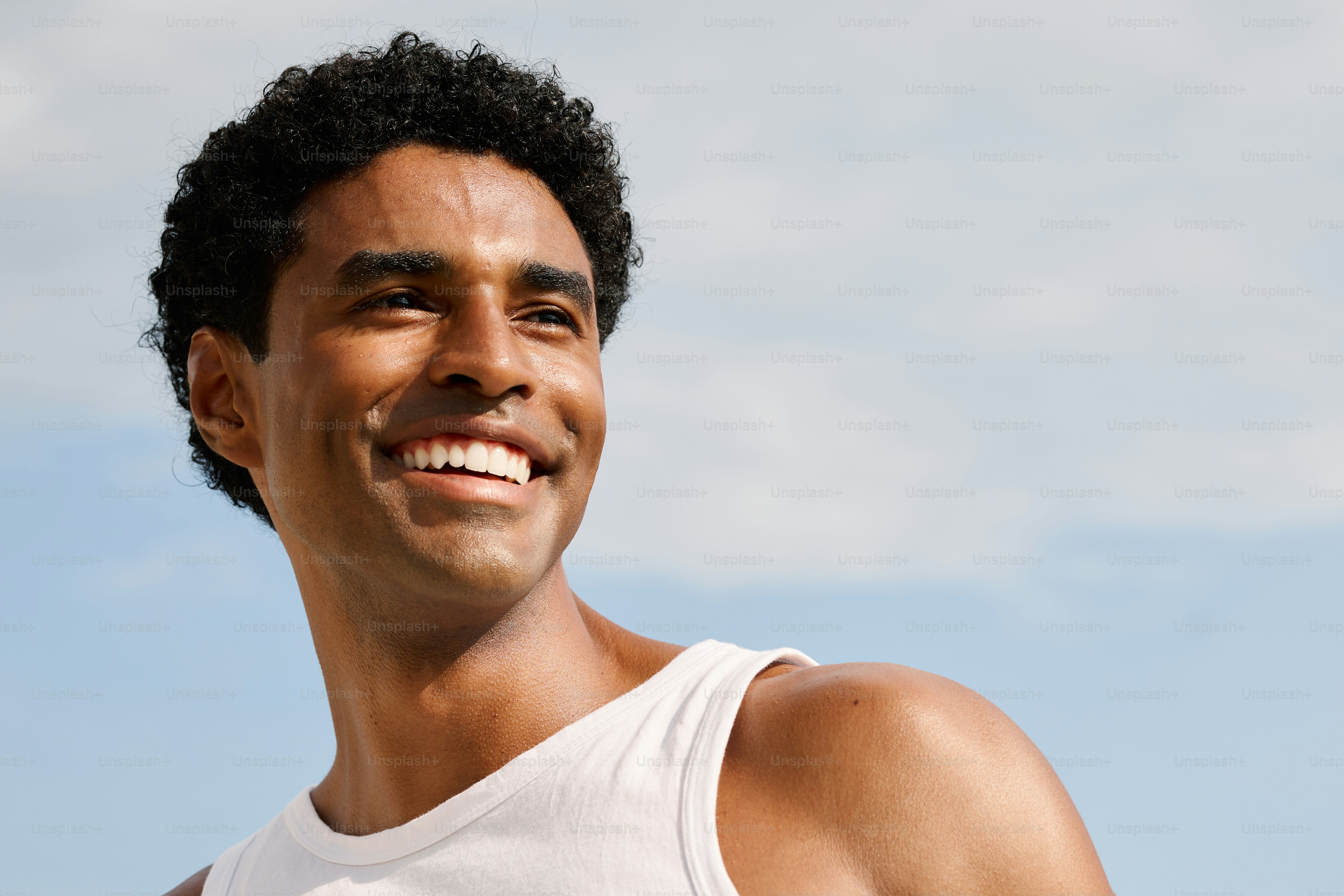 a close up of a person wearing a tank top