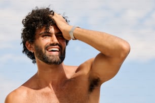 a shirtless man with a watch on his left hand