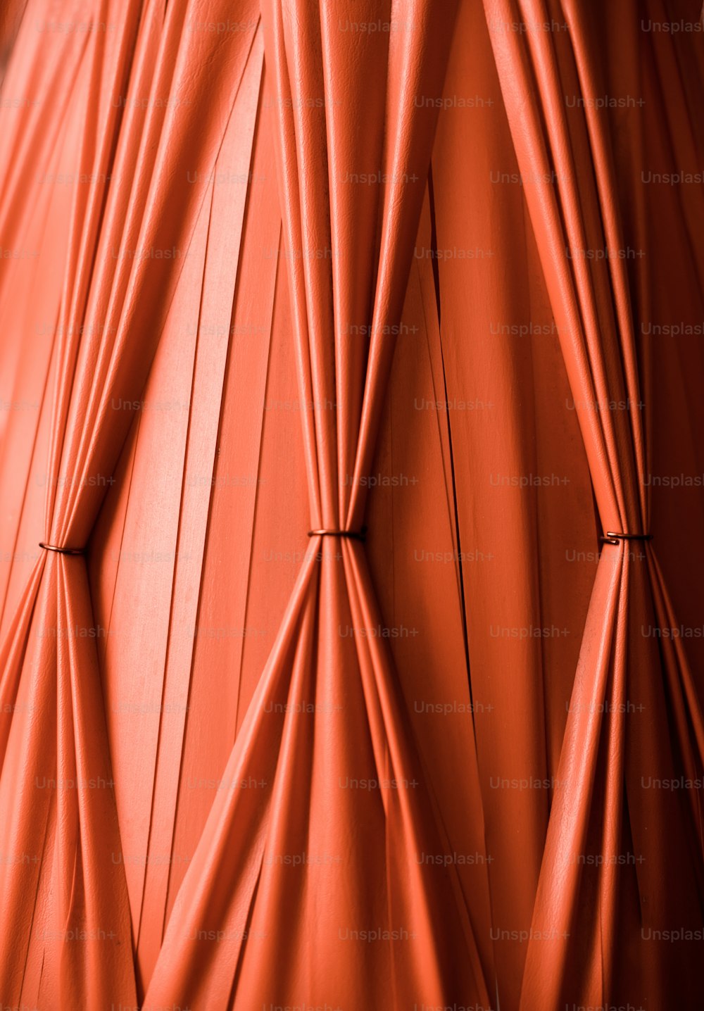 a close up view of a red curtain