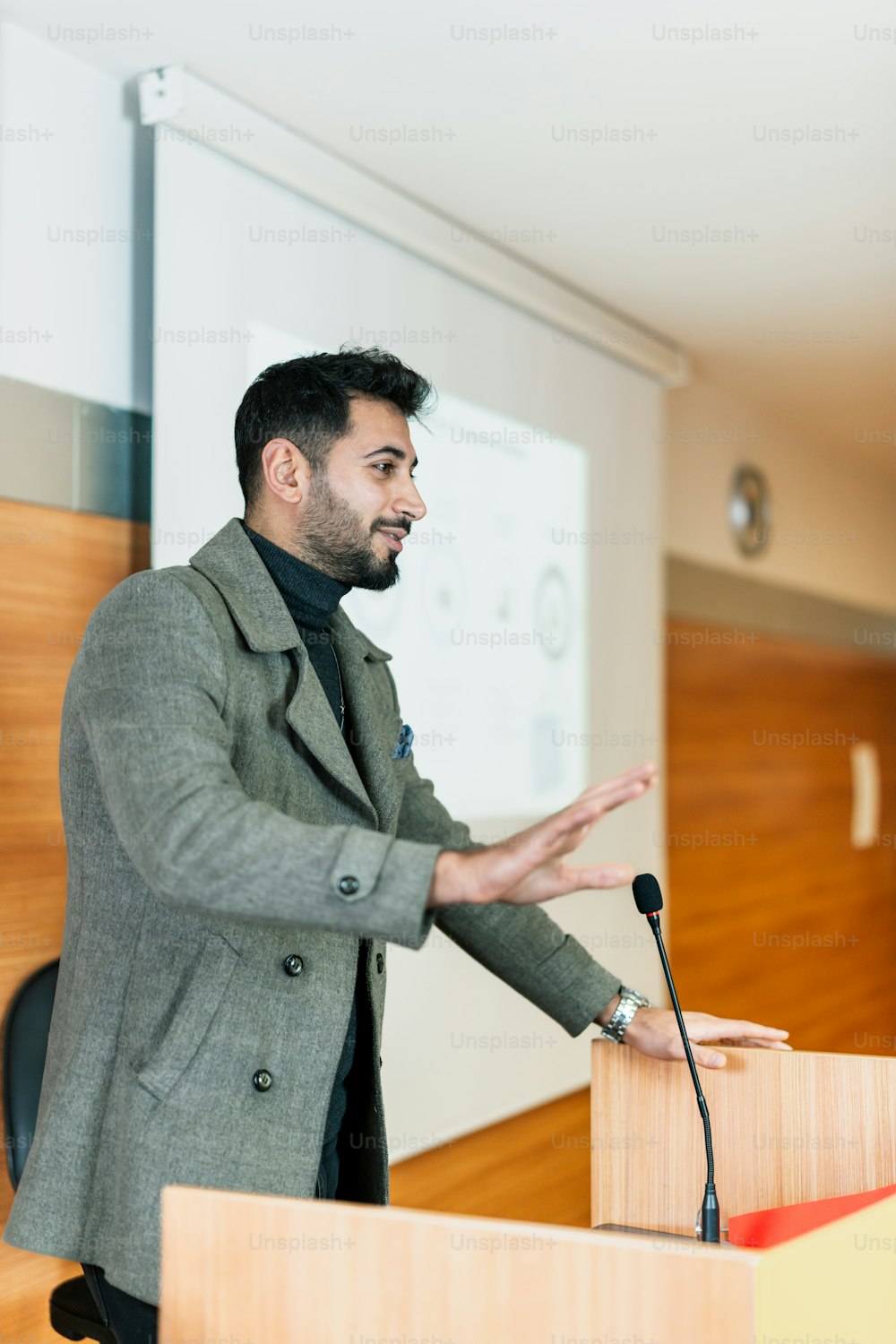 a man standing at a podium giving a speech