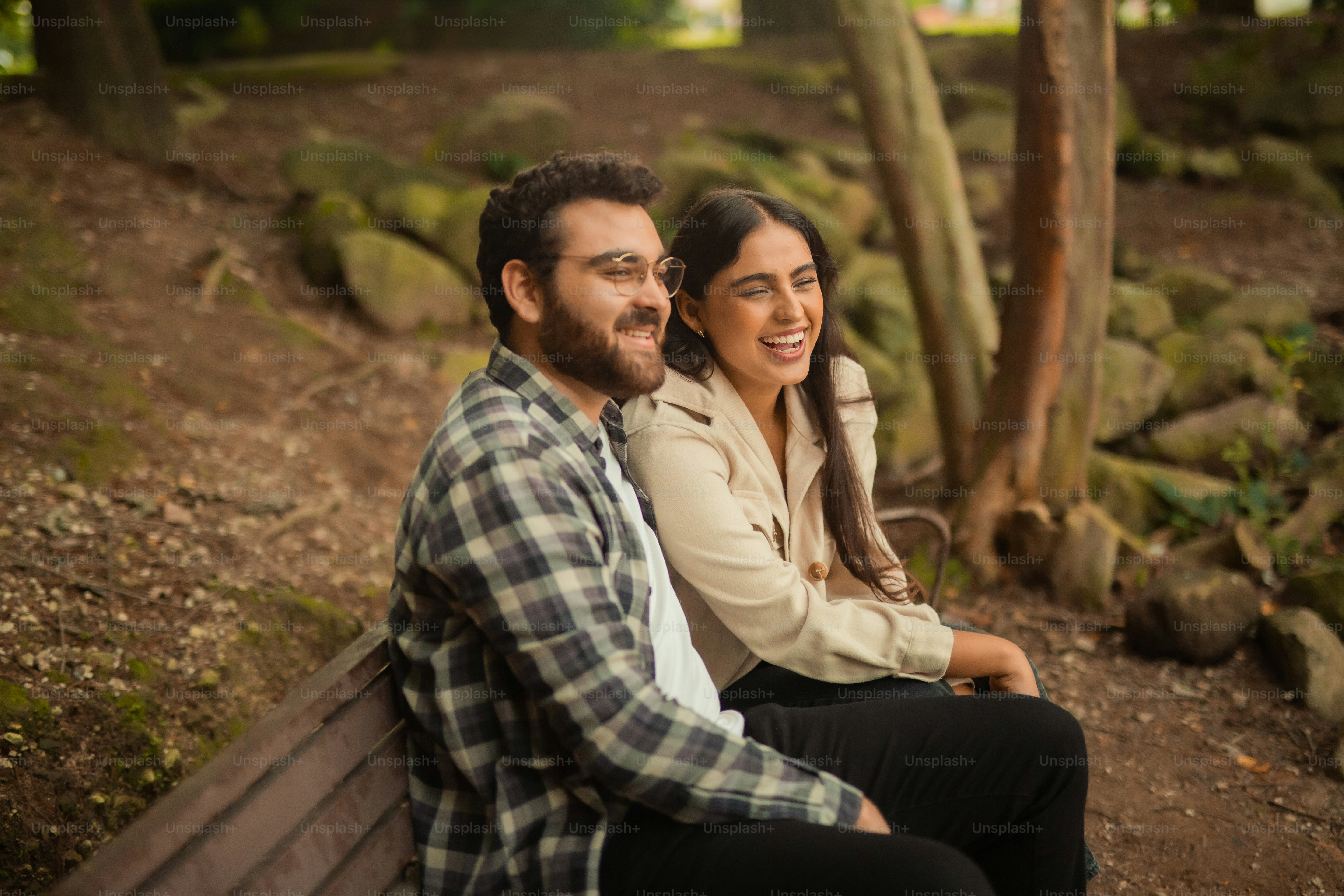 a man and a woman are sitting on a bench