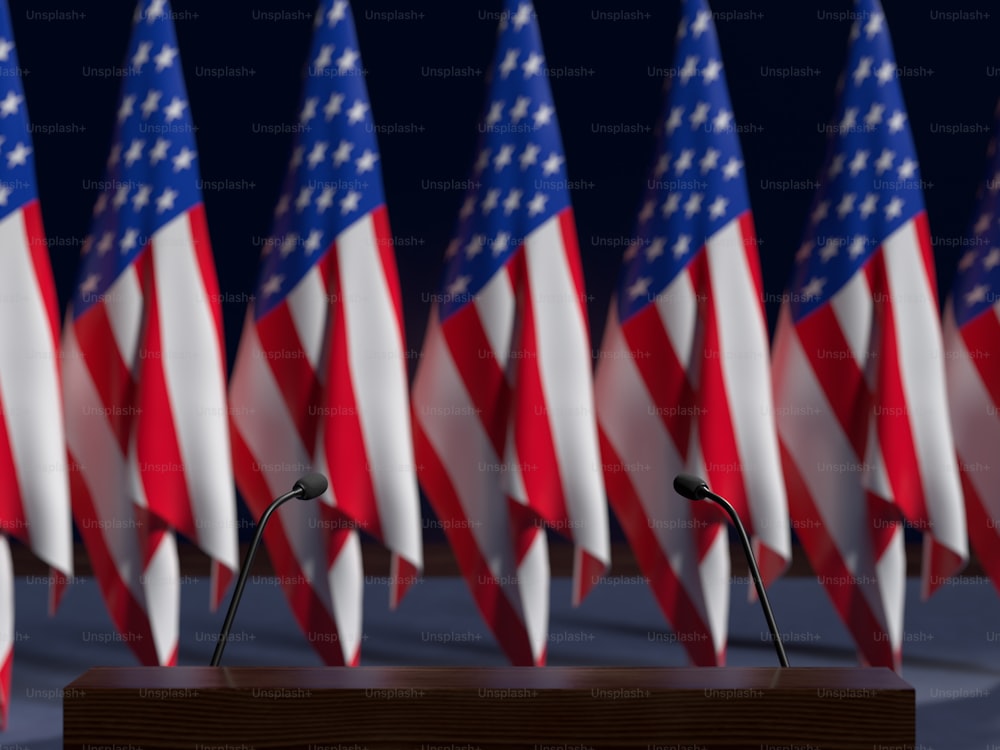a podium in front of a row of american flags