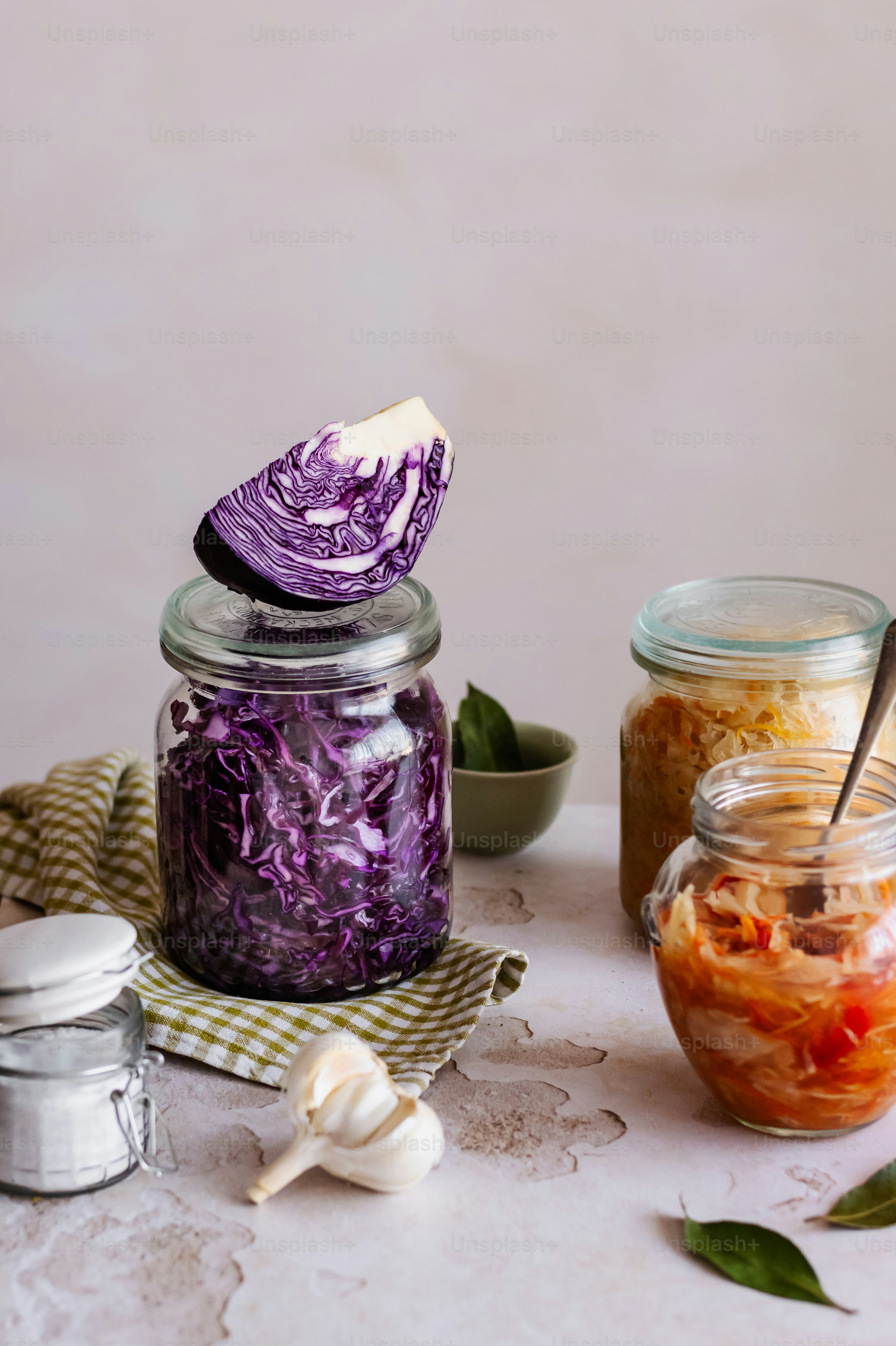 a table topped with jars filled with food