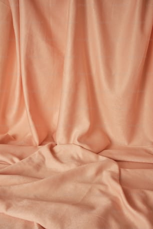 a close up of a peach colored cloth