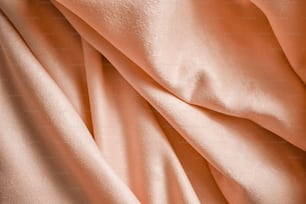 a close up of a peach colored fabric