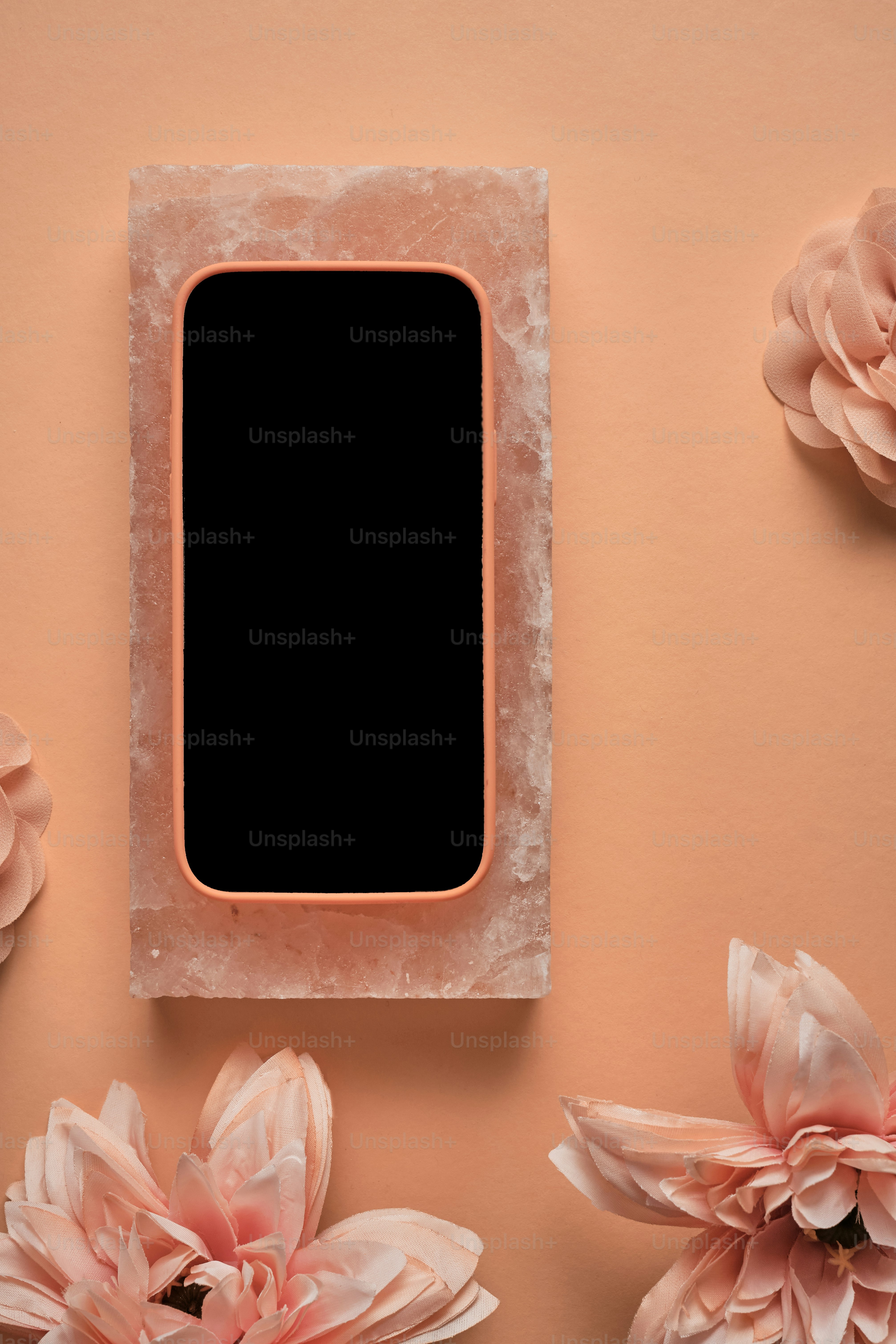 a pink flower arrangement with a black square in the center