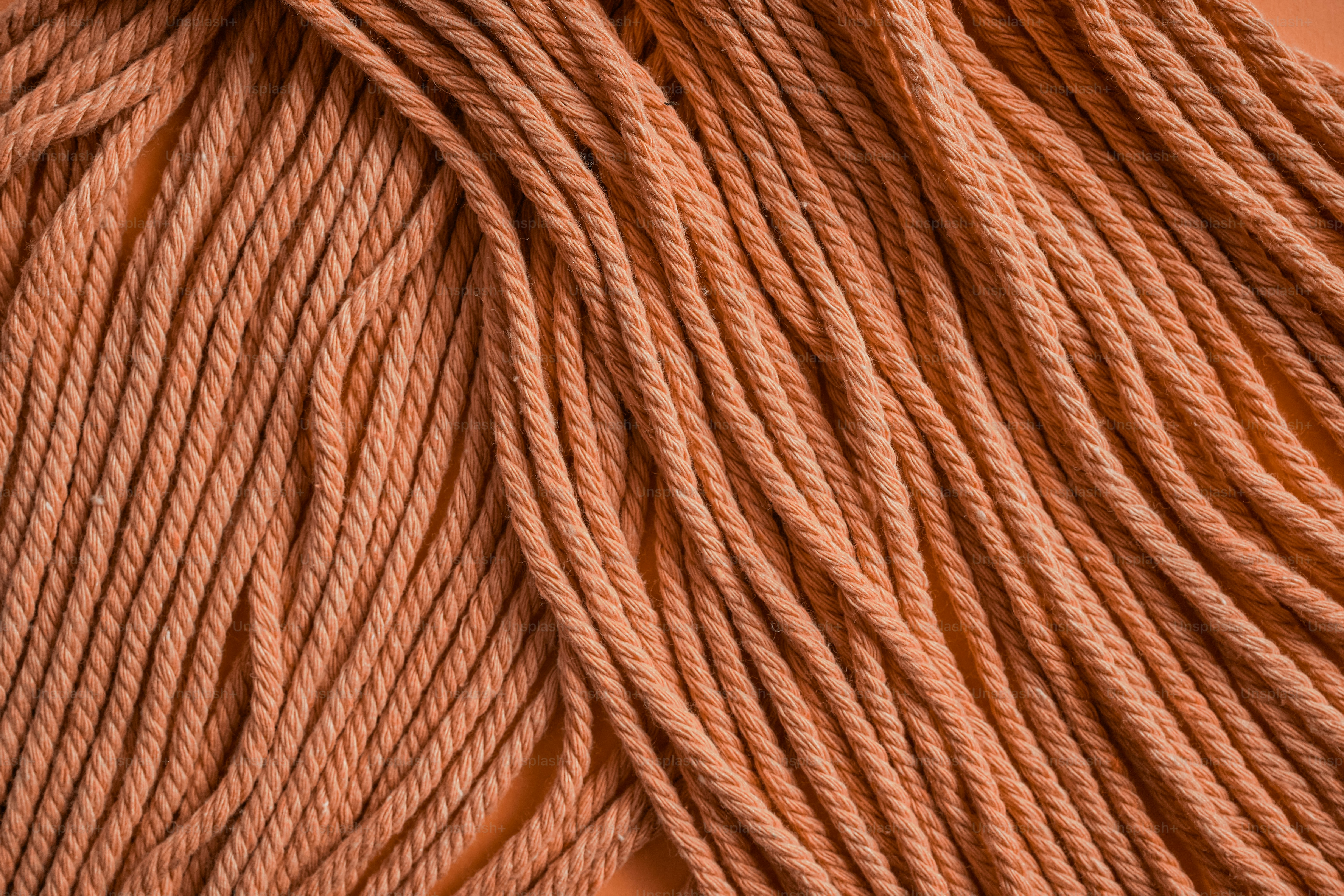 A close up of a rope on a table photo – Peach fuzz Image on Unsplash