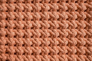 a close up of a crocheted blanket made of yarn