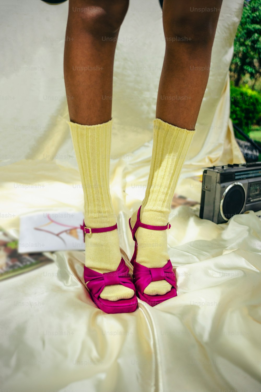 a person wearing yellow socks and pink shoes