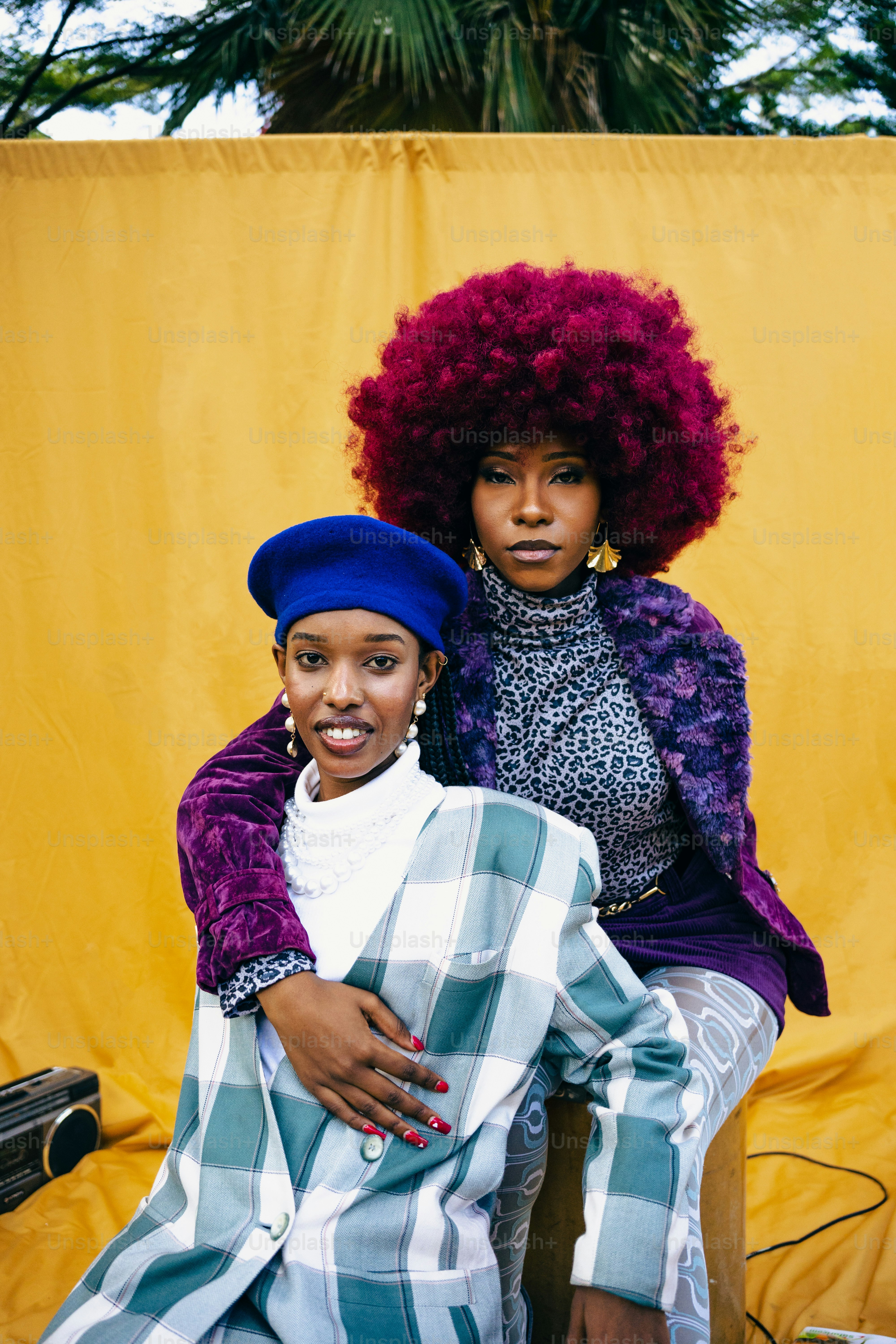 a couple of women sitting next to each other