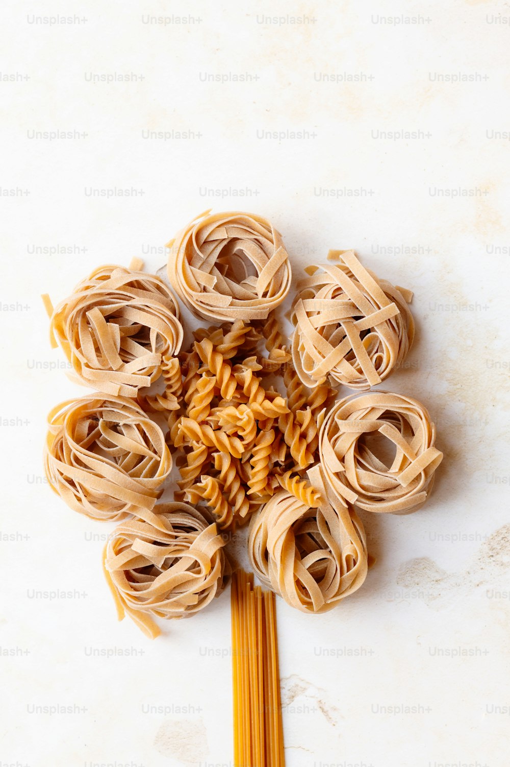 a bunch of pasta on a stick on a table