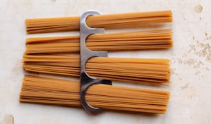 a bunch of pasta being cut with a scissor