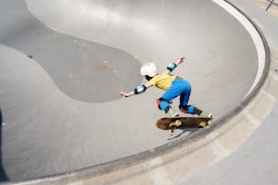 a man riding a skateboard up the side of a ramp