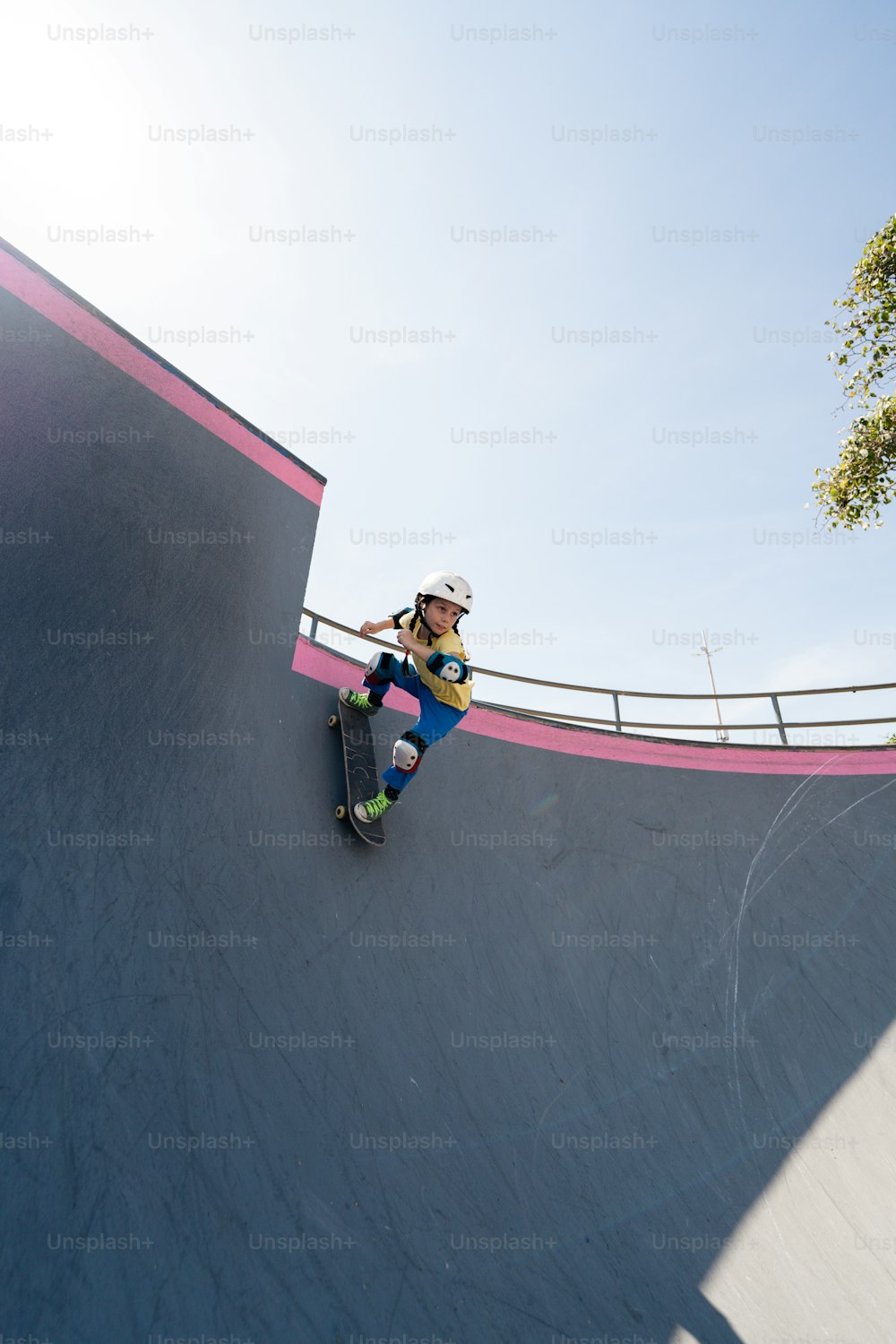 a man riding a skateboard up the side of a ramp