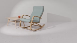 a blue rocking chair next to a small table