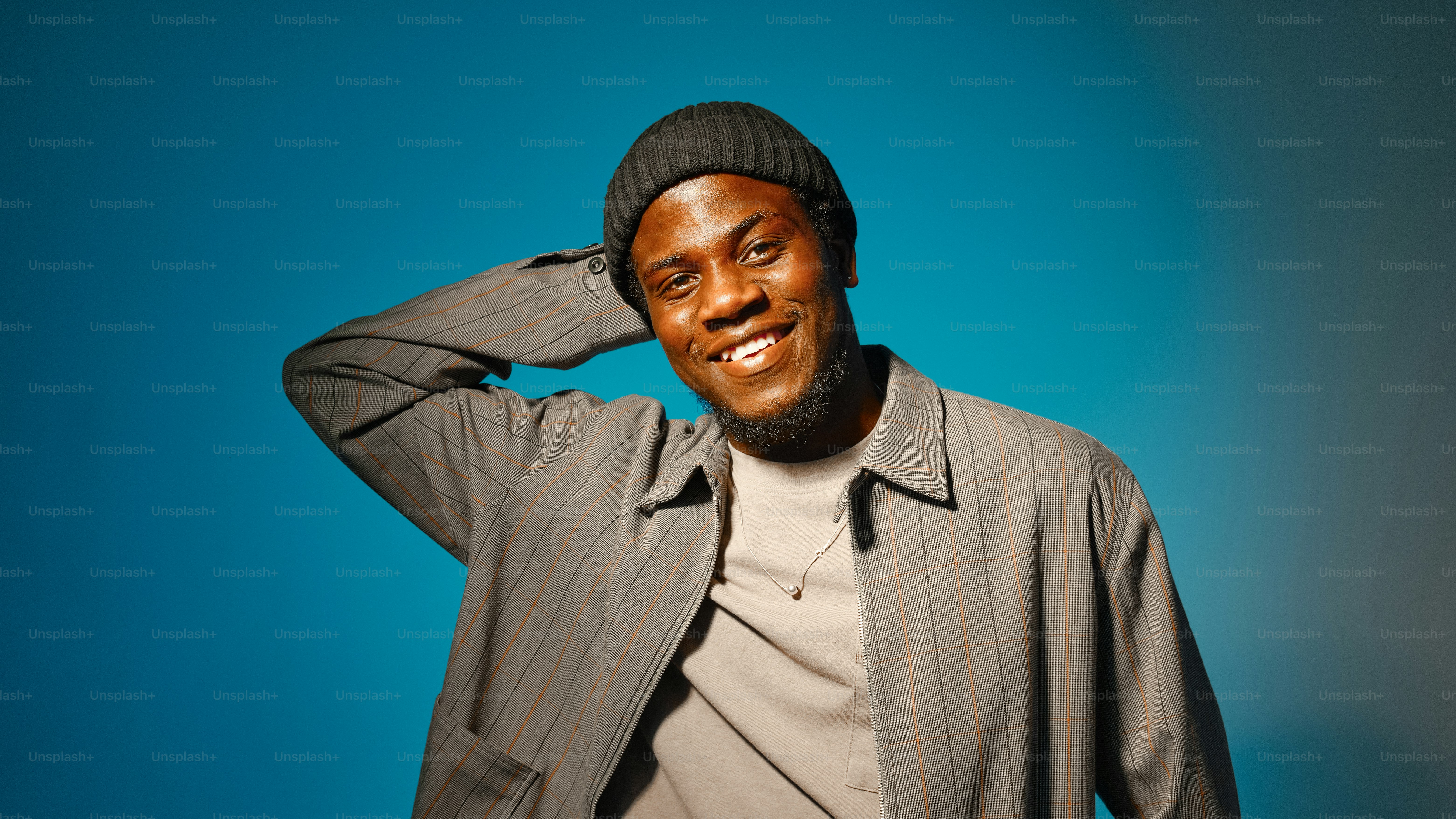 a man with a beard wearing a hat