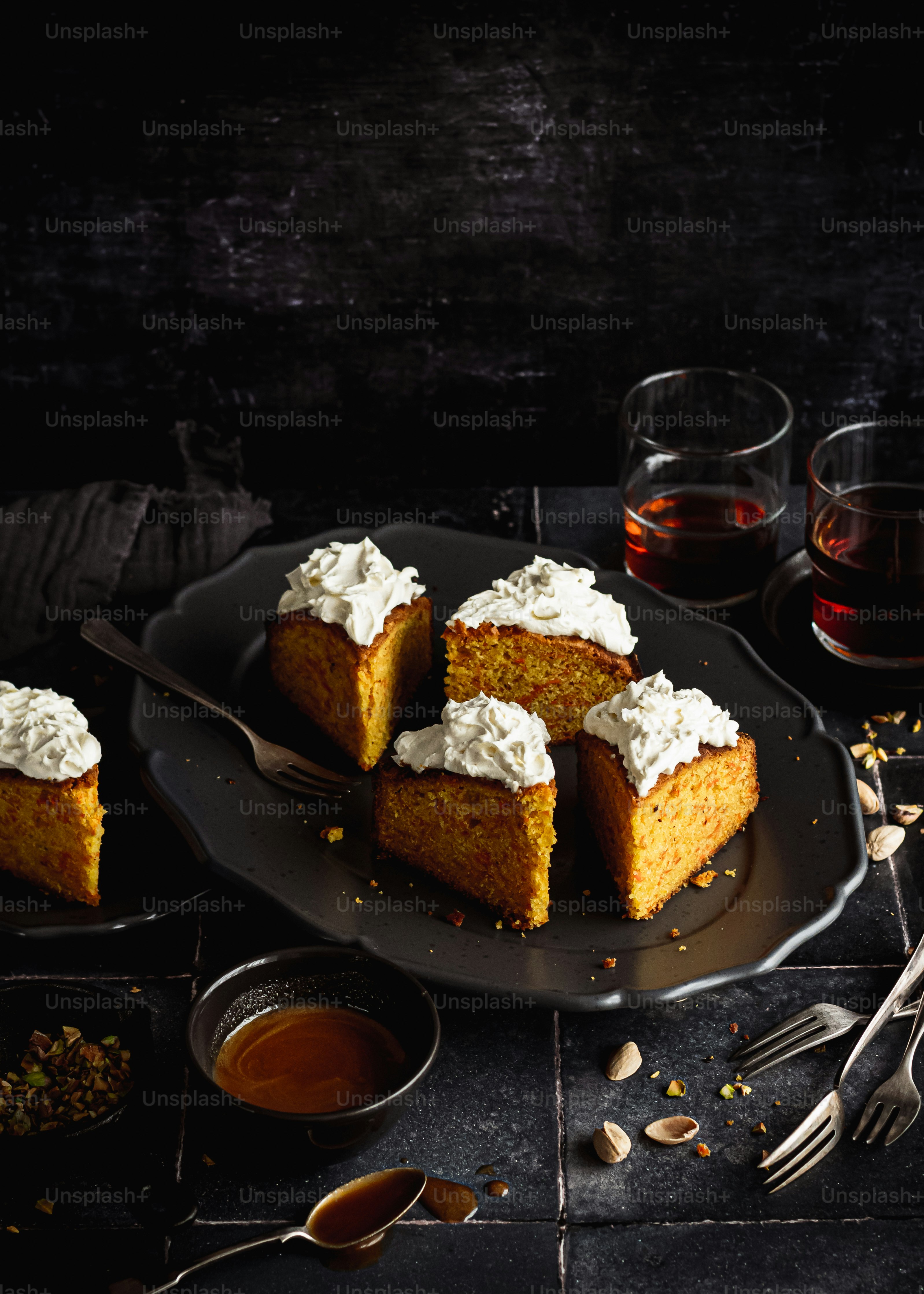 a black plate topped with slices of cake