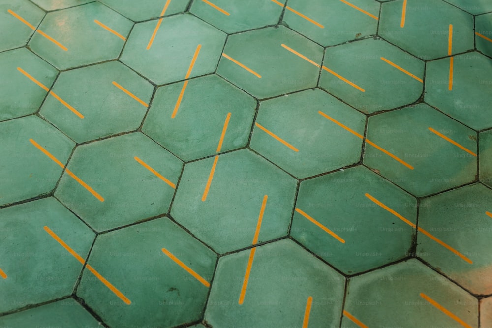 a tiled floor with yellow lines on it