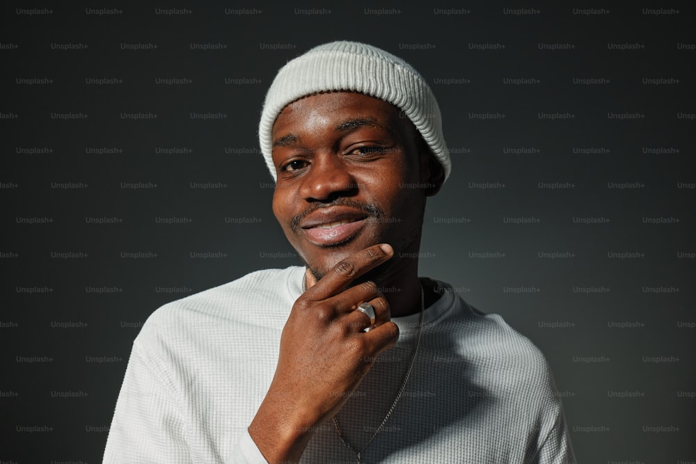 a man in a white shirt and a white hat