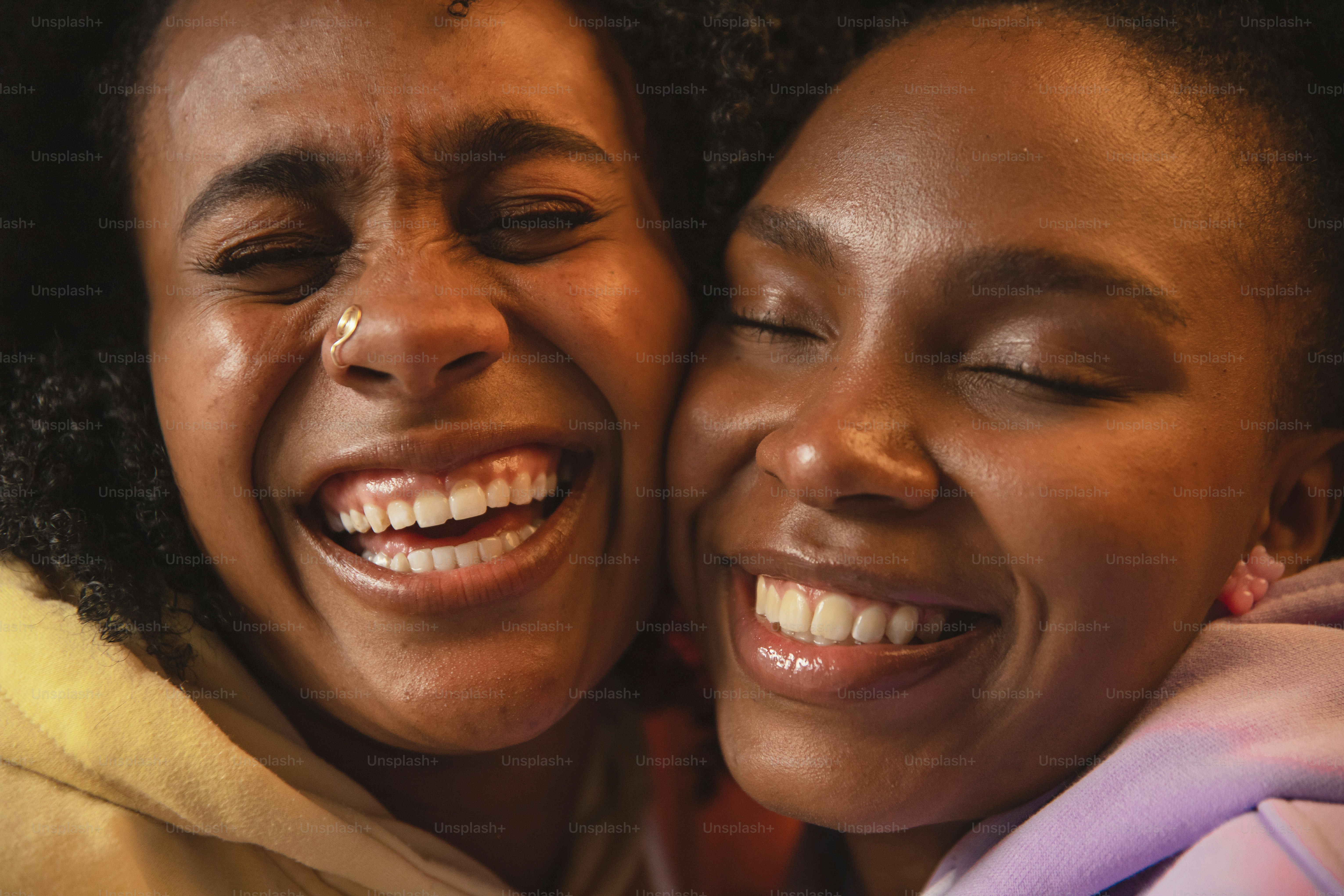 a close up of two people hugging each other