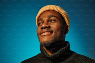 a man wearing a sweater and a hat