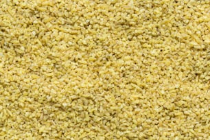 Un primer plano de una textura de arroz amarillo