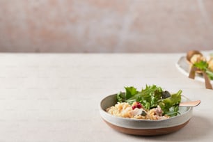 a bowl of food sitting on top of a table