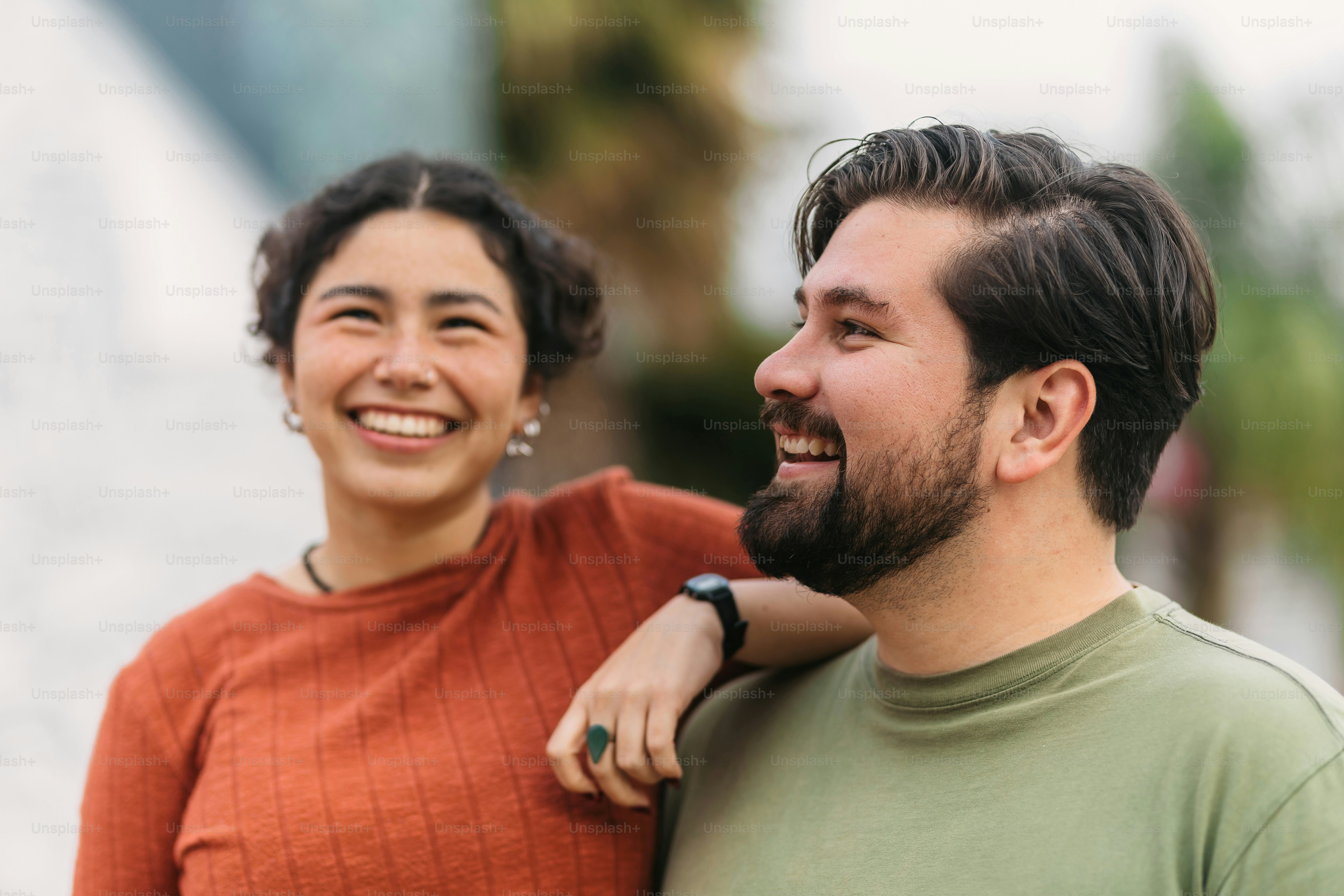 a man and a woman smiling at each other