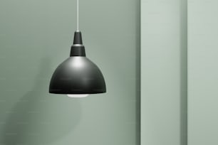 a black light hanging from a green wall