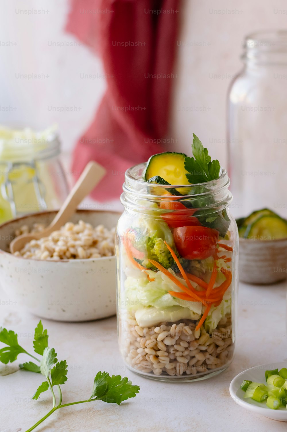 a mason jar filled with rice and vegetables