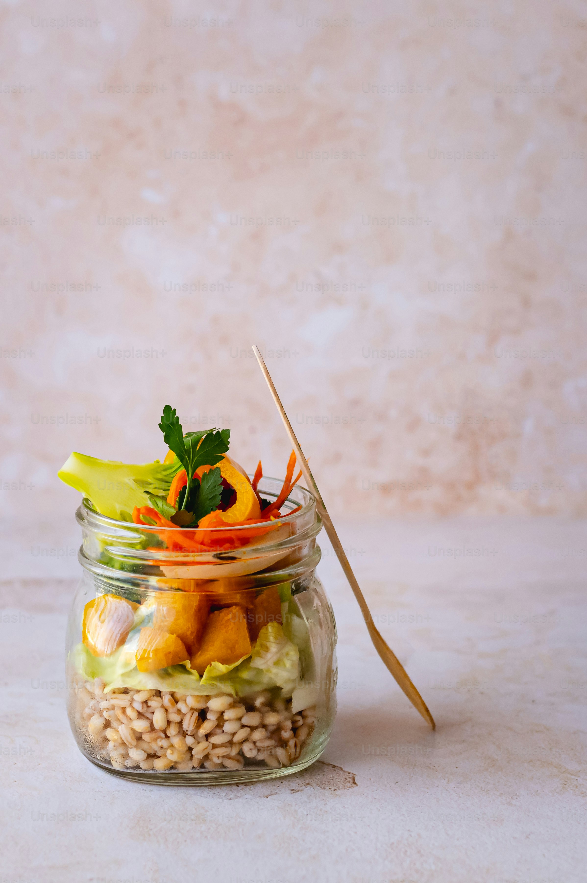 A glass jar filled with food sitting on top of a table photo – Whole ...