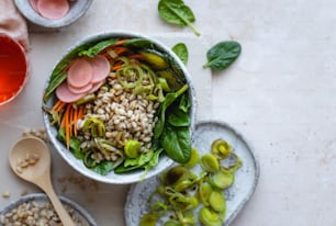 a bowl of food with a spoon next to it