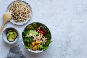 a couple of bowls of food on a table