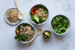 three bowls filled with different types of food