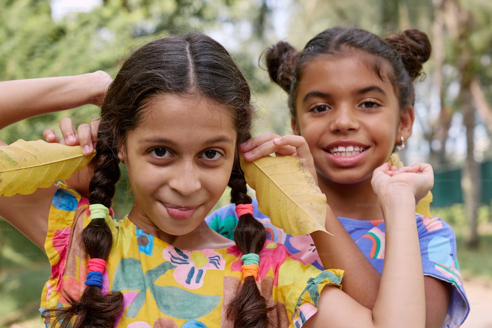 two young girls standing next to each other