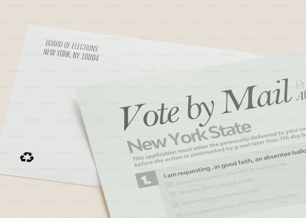 a close up of two mail envelopes on a table