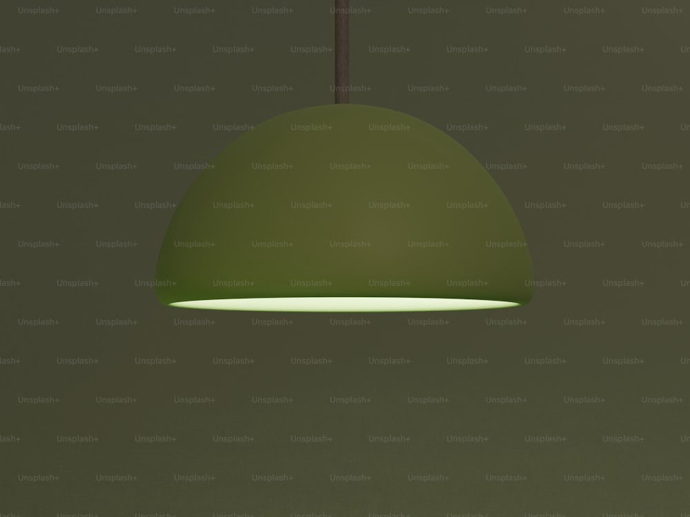 a green light hanging from a ceiling in a room