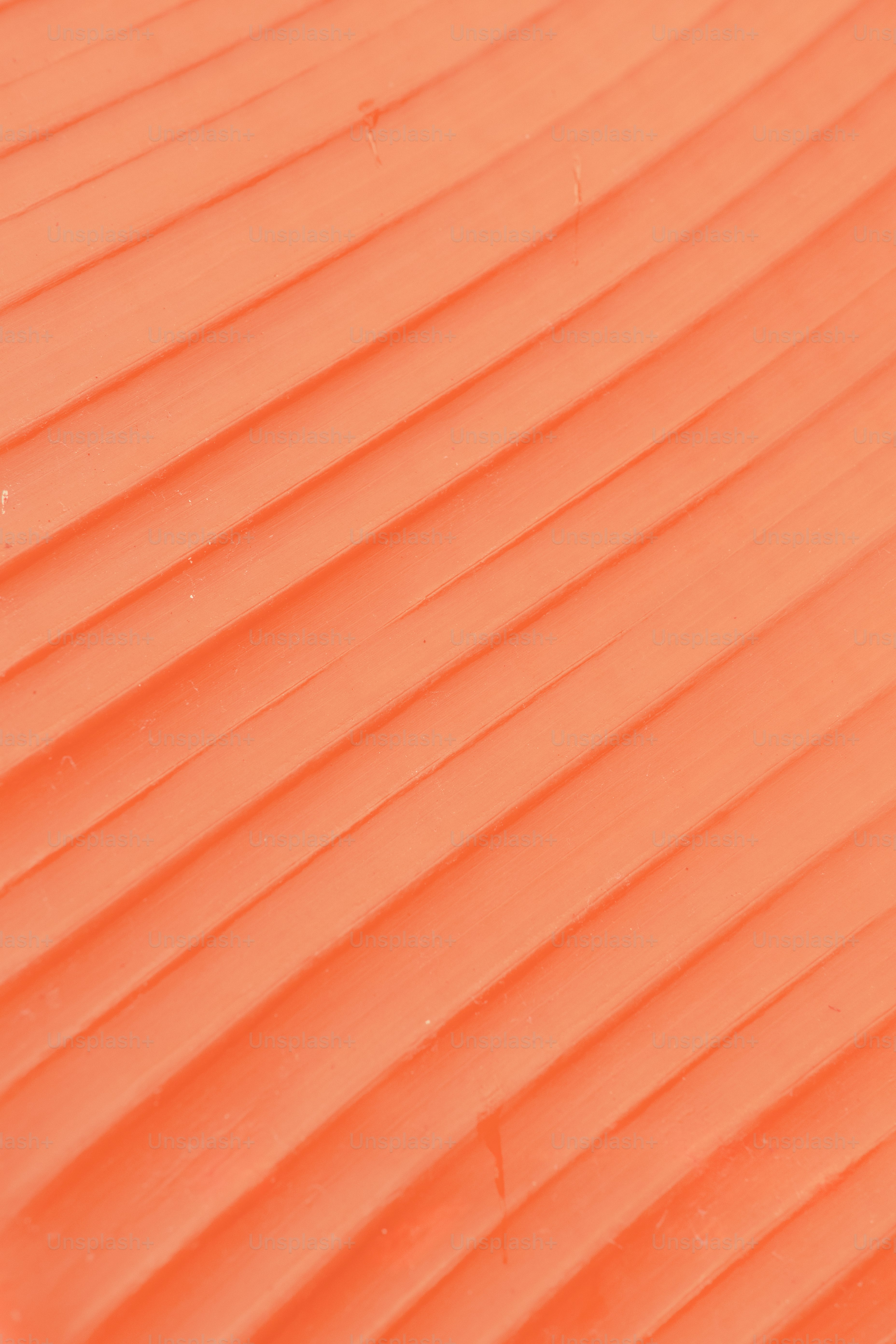 a person riding a snowboard down a snow covered slope