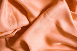 a close up of a peach colored fabric